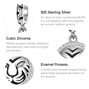 Macro detail of 925 sterling silver tiger charm with cubic zirconia and black enamel