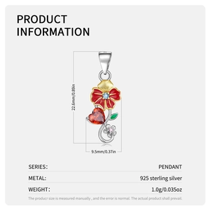 Macro view of S925 silver heart pendant with enamel flower and red gemstone details
