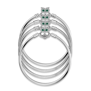 S925 sterling silver snake chain bracelet with green-eyed owl charms on white background