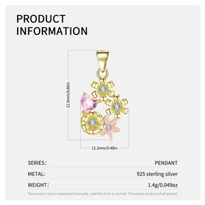 Detail of floral S925 silver pendant with pink heart stone and blue flower gems