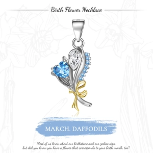 Detail of S925 silver March birth flower pendant with heart blue gem and gold bow