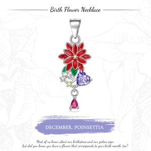Close-up of S925 silver December Poinsettia pendant with red enamel and gemstones