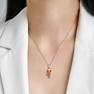 S925 sterling silver December flower necklace with red heart pendant on female model