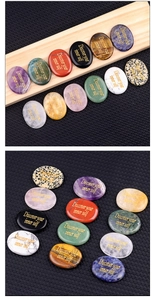 Macro shot of natural crystal palm stones with engraved gold 'Discover your inner self' text