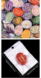 Macro view of assorted worry stones with gold Discover your inner self engraving