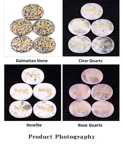 Detailed set of natural palm stones with golden Om Mani Padme Hum mantra engraving