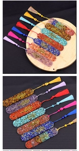 Detail of resin bookmarks featuring Tree of Life metal charms and colorful crystal stones