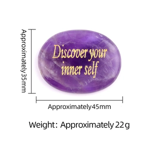 Purple natural crystal palm stone engraved with Discover your inner self in gold lettering