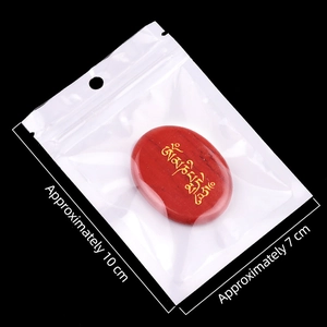 Red oval Om Mani Padme Hum palm stone with golden Tibetan script in a 10x7cm package