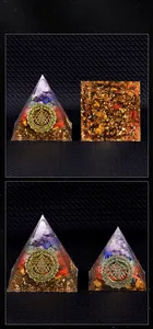 Macro view of Orgone pyramid featuring multi-layered natural stones and metal hexagram symbol