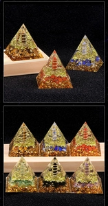 Macro detail of Orgone energy pyramid featuring colorful crystals and metal spiral coils