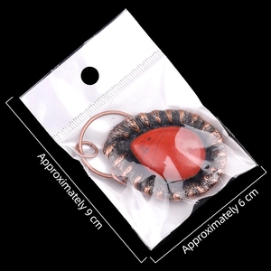 Collier vintage avec pendentif en agate rouge en forme de goutte et base en alliage