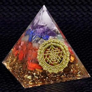 Handmade resin Orgone pyramid with natural chakra stones and golden Sri Yantra symbol
