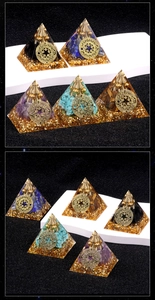 Macro view of crystal healing energy pyramids with resin encased gemstones and copper