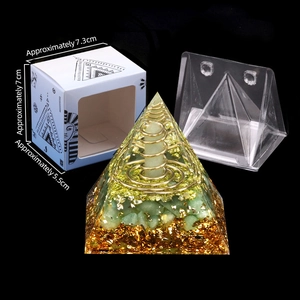 Green crystal orgone pyramid with gold leaf and resin, Egyptian Pharaoh box included