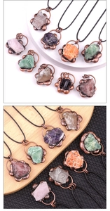 Detail of vintage copper flower pendant with raw natural crystals on adjustable black cord