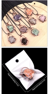 Detail of stone pendants showing product packaging dimensions of 9 cm by 6 cm