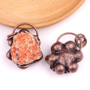 Vintage style pendant necklace featuring raw natural carnelian stone and bronze textured metal
