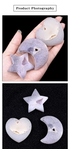 Detailed macro view of heart, star, and moon shaped natural agate geodes with crystals