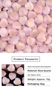 Macro detail of 25mm rose quartz heart stones with golden Love engraving