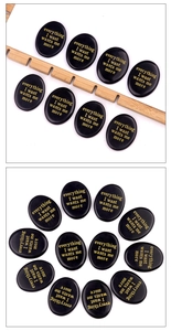 Polished oval obsidian worry stone featuring gold engraved inspirational text on black