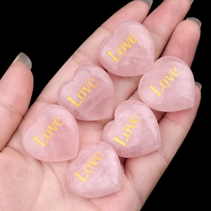 Handheld set of six rose quartz heart stones with gold Love engraving for wedding gifts