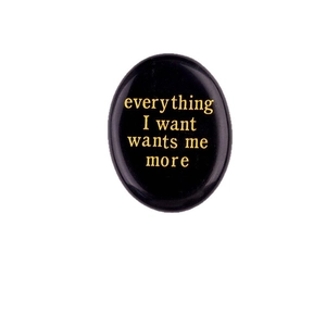 Polished black obsidian worry stone with gold everything I want wants me more engraving
