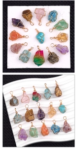 Macro detail of handmade wire wrapped natural crystal pendants in various gemstones