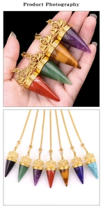 Detailed view of natural stone pendulum pendants with gold lotus caps in various colors