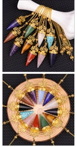 Detailed view of hex crystal pendulum with golden lotus cap and matching beads