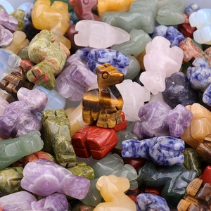 Miniature hand-carved natural crystal animal figurines in amethyst and tiger eye stone