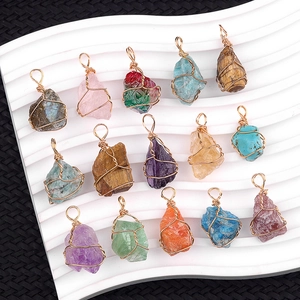 Handcrafted wire wrapped natural crystal pendants in assorted healing stones and gold wire