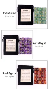 Three sets of polished runes in aventurine, amethyst, and red agate with storage pouches