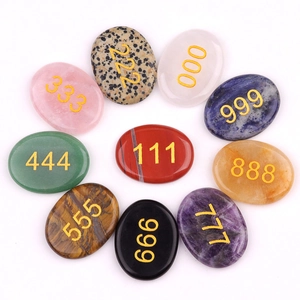 Set of 10 oval natural crystal energy stones with engraved golden angel numbers