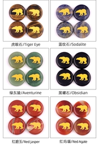 Detailed grid of 25mm natural crystal stones with golden polar bear engravings in six colors
