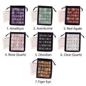 7 sets of natural rune stones with gold engraving, velvet pouch and instruction card
