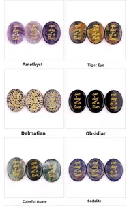 Macro display of six natural crystal palm stones with one day at a time gold engraving