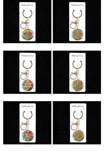 Detailed grid of resin flower keychains with assorted colorful crystal stones and symbols