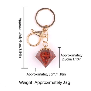 Diamond shaped resin keychain with natural red crystal stones and golden lobster clasp