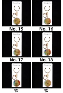 Detailed grid of colorful crystal resin flower keychains with golden metal charms No. 15-20