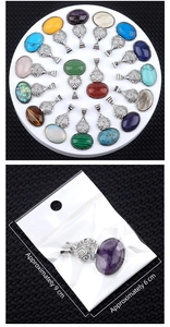 Macro detail of various natural crystal agate pendants with vintage engraved alloy bails