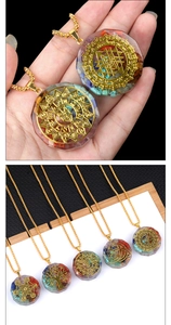 Macro detail of Orgone energy pendant featuring colorful natural crystals and sacred geometry