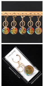 Detail of seven chakra crystal resin keychain with gold symbols and dimensions measurement