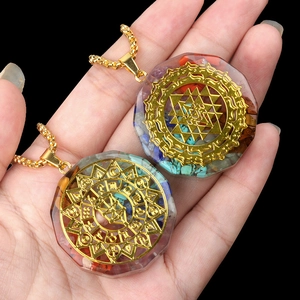 Octagonal resin pendant necklace with natural colorful crystals and golden geometric symbols