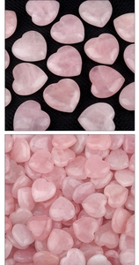 Polished natural pink rose quartz heart stones showing smooth texture and translucent details