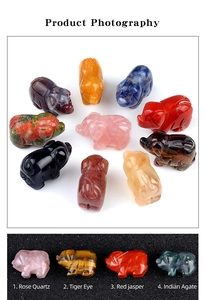 Detail of hand-carved gemstones showing Rose Quartz and Tiger Eye pig figurines