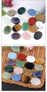 Close-up of polished oval gemstone pendants including amethyst and tiger eye for DIY jewelry