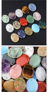 Macro view of polished oval semi-precious stone pendants with pre-drilled holes