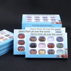 Set of 12 hand-carved gemstone pig figurines in a blue display box made of natural minerals