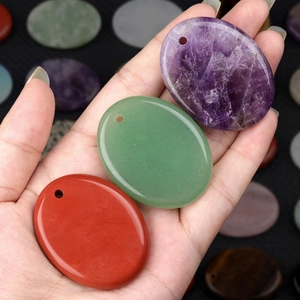 Polished oval palm stone pendants in natural crystal quartz with pre-drilled holes